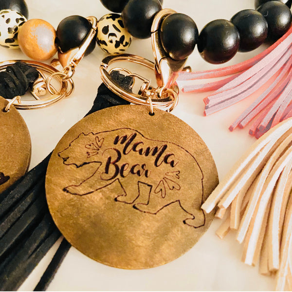Wooden beads bracelets with engraved charm and tassel