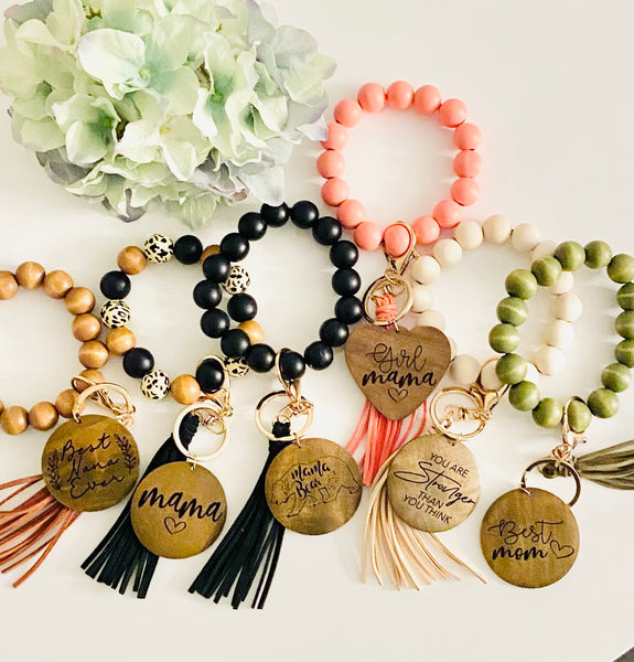 Wooden beads bracelets with engraved charm and tassel